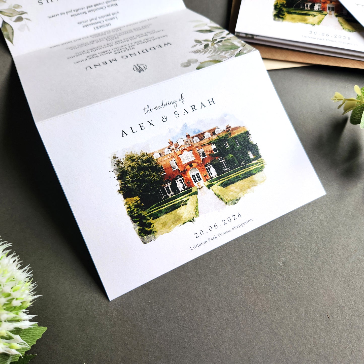 Venue watercolour wedding invitations featuring a painting illustration of your chosen wedding venue. Concertina fold wedding invites complete with personalised tags, rustic twine and a choice of envelopes.