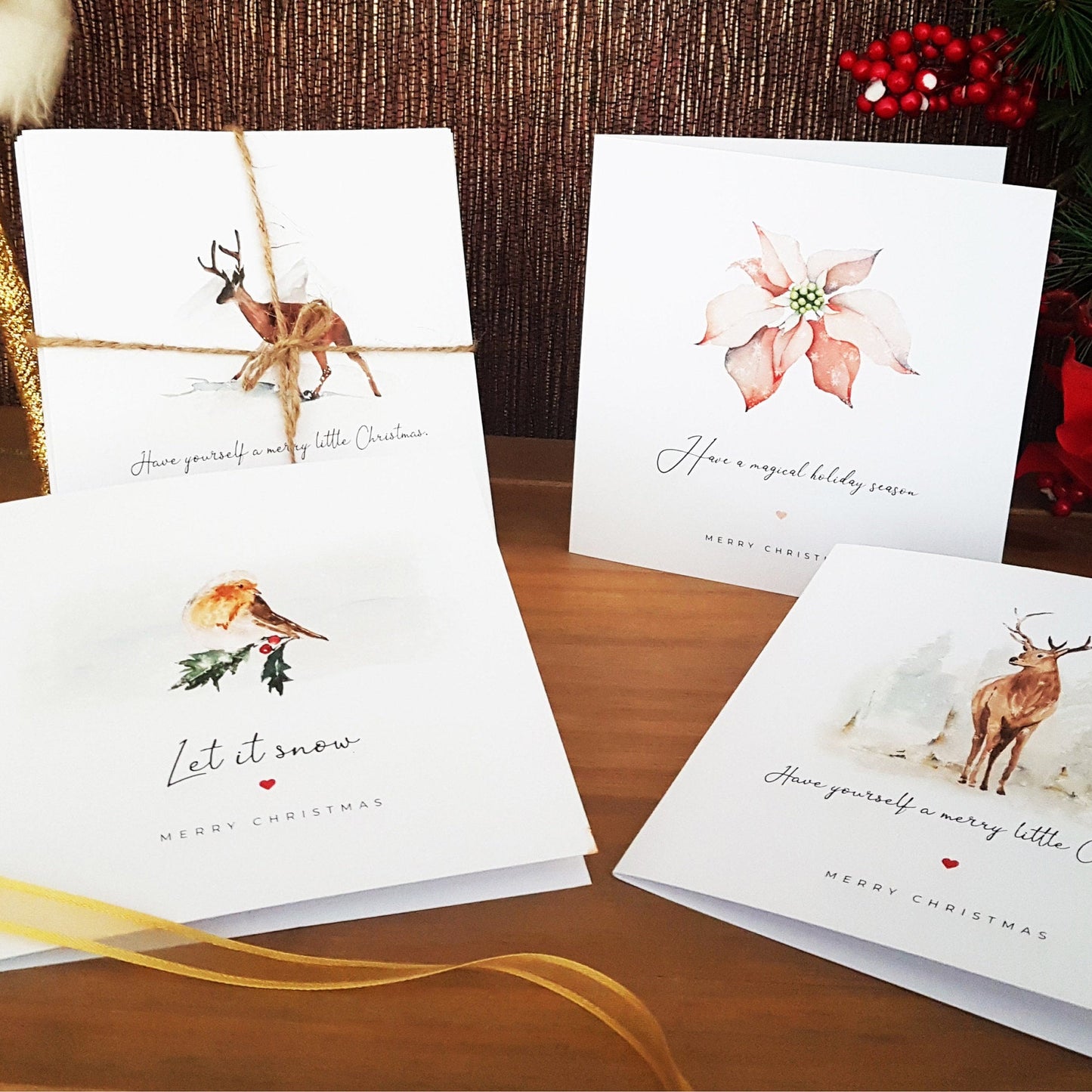 Set of Christmas cards with reindeer and floral designs