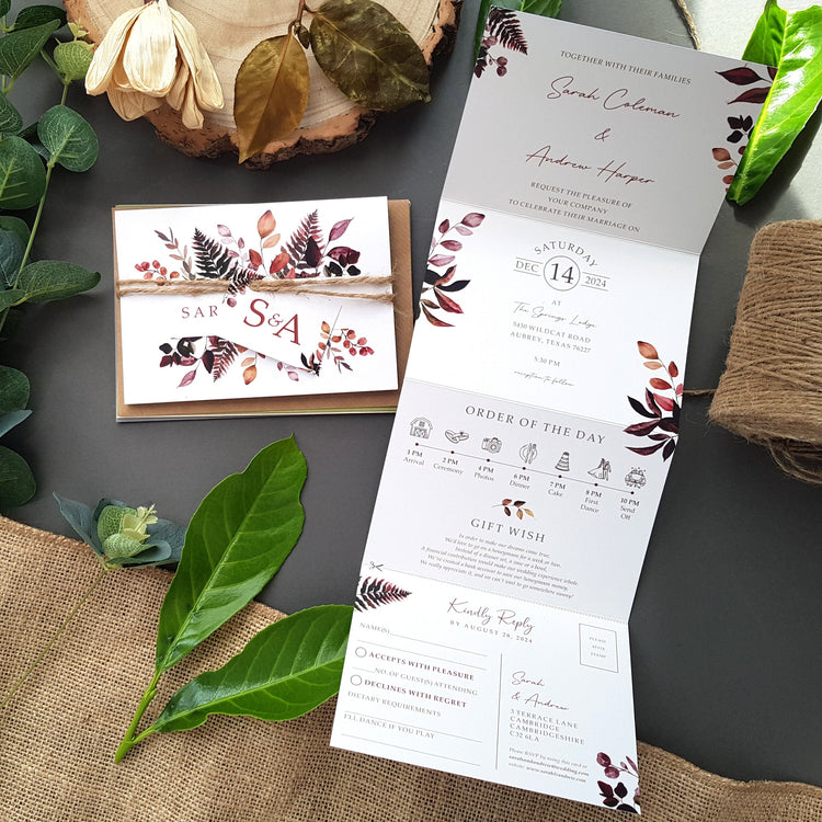 Burgundy wedding invitations with envelopes rustic twine and personalised tags perfect for an autumn wedding