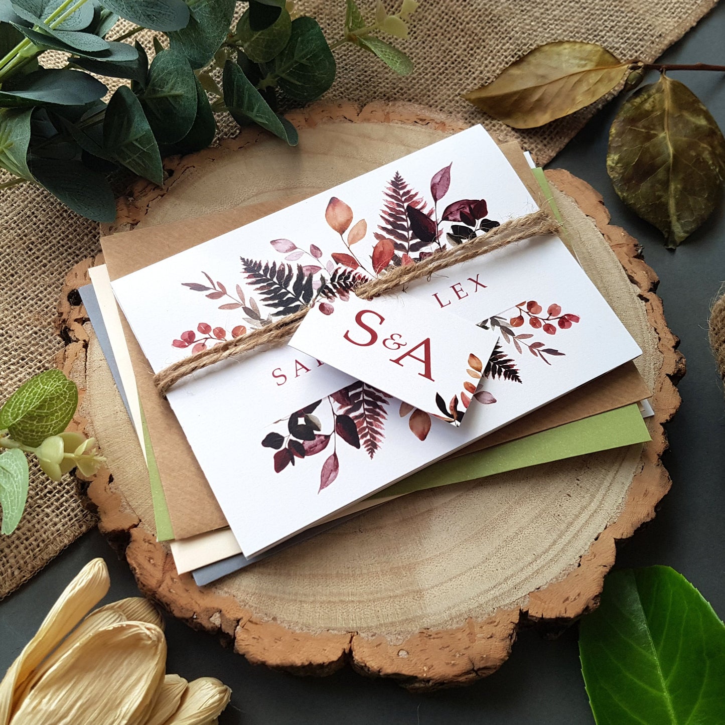 Burugundy hues wedding invitation set with envelopes rustic twine and tags. perfect for an autumn fall wedding