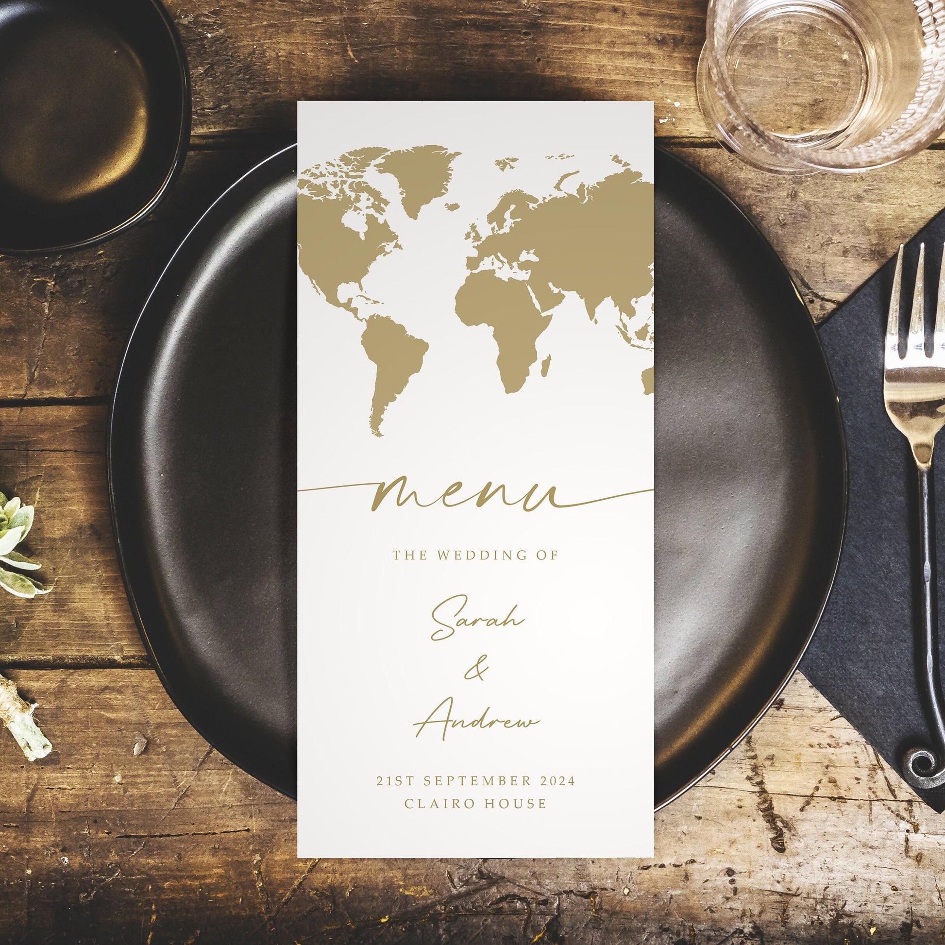 world map wedding menus with gold details matching passport invitations for destination wedding