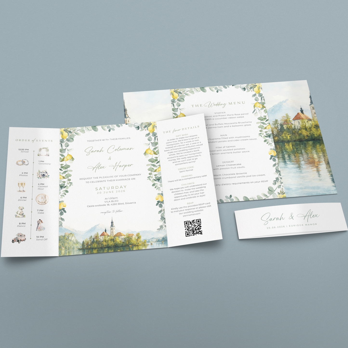 A wedding invitation suite displayed on a soft blue-gray background, including a folded program/booklet, a separate page, a QR code card, and a name card. The design features watercolor landscapes with green foliage and yellow flowers, elegant script text, and a scenic lake-and-castle illustration.