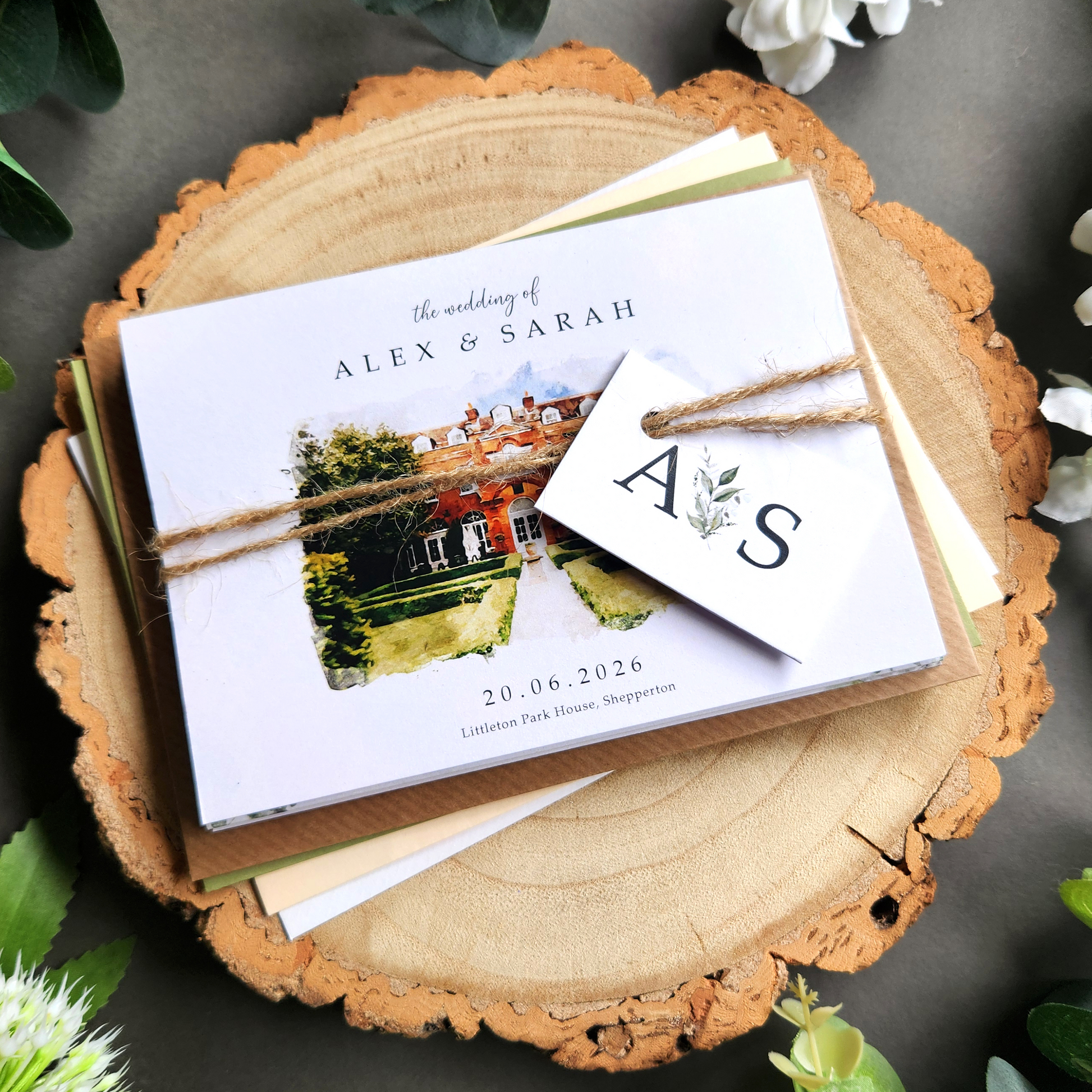 Venue watercolour wedding invitations featuring a painting illustration of your chosen wedding venue. Concertina fold wedding invites complete with personalised tags, rustic twine and a choice of envelopes.