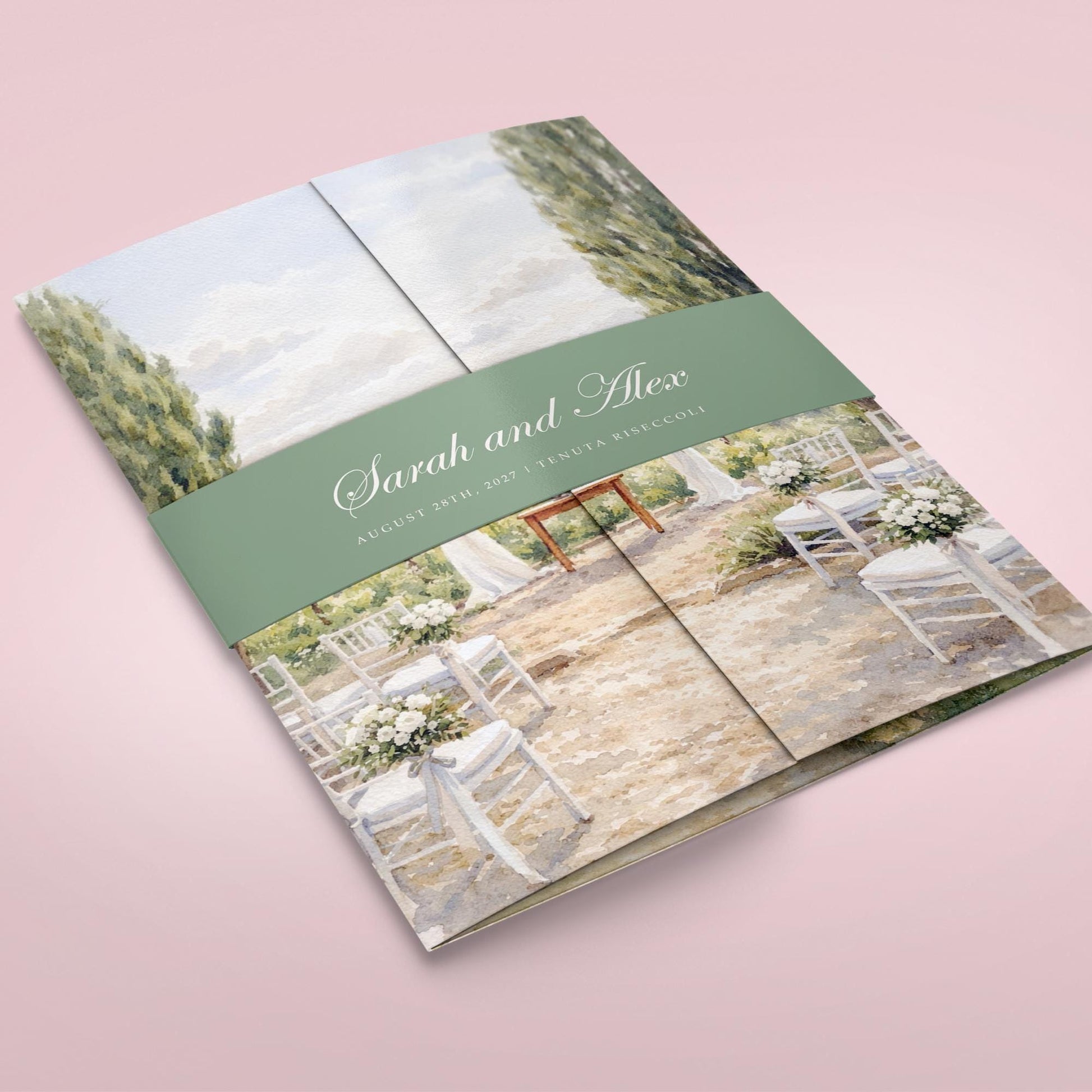 A wedding invitation featuring a scenic outdoor setting with chairs and flowers, along with the names 'Sarah and Alex' printed on it.